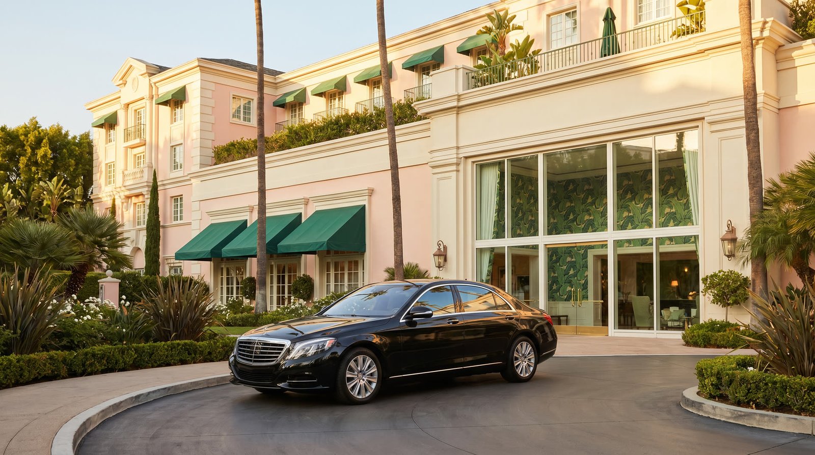 Black SUV at Beverly Hills Hotel pink and cream entrance